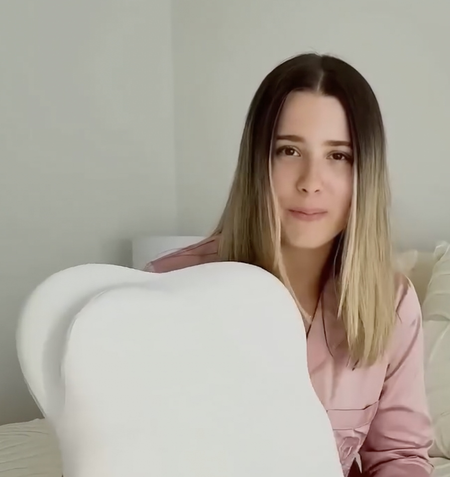 Cloud Pillow customer holding the pillow